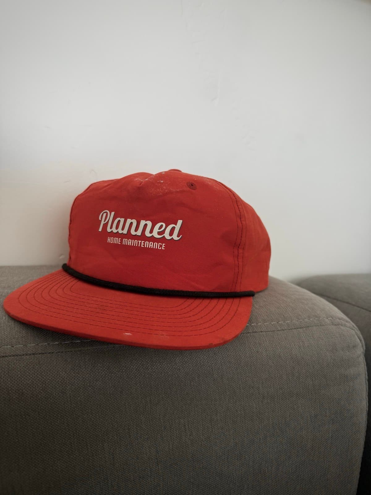 Planned branded orange rope hat