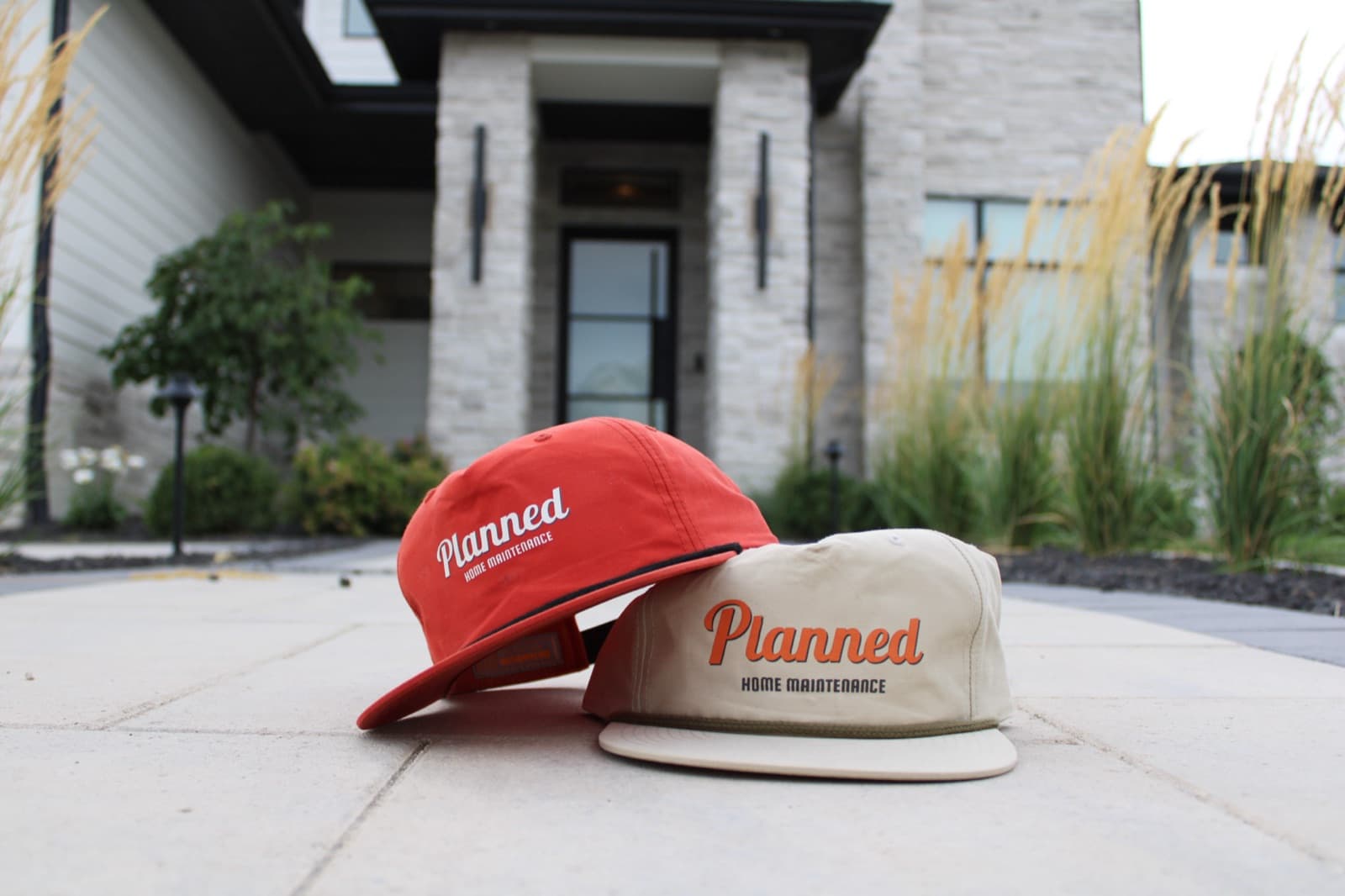 Planned rope hats in orange and cream on a front porch