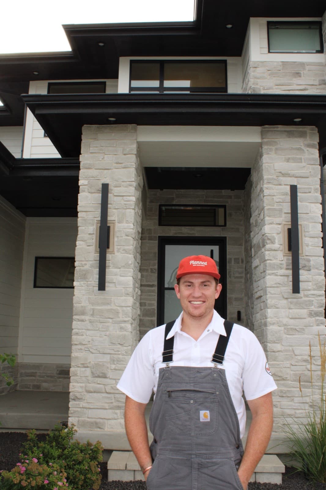 Cory from Planned Home Maintenance standing in front of a Utah home